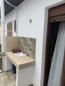 a kitchen with a sink and a counter top at BACI HOUSE in Limenas +13 photos