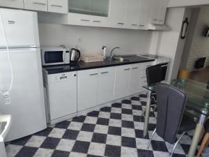 Kuchyň nebo kuchyňský kout v ubytování Milmar apartman