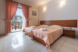 Postel nebo postele na pokoji v ubytování J Studios - Kineta Seaside Retreats
