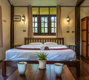 Кровать или кровати в номере Little Village Chiang Mai