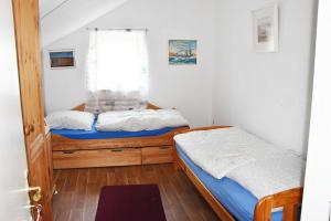a bedroom with two beds and a window at Apartment in Euskirchen in Euskirchen