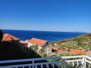 a view of the ocean from a house at Apartment Zagalo in Sveta Nedelja
