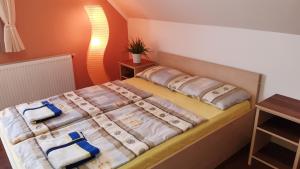 Postel nebo postele na pokoji v ubytování TABÁN Apartman