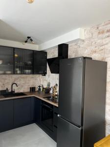 Kuchyň nebo kuchyňský kout v ubytování CUBE Residence