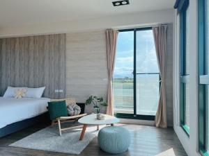 Postel nebo postele na pokoji v ubytování Wei Wei Chu B&B