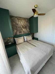 Postel nebo postele na pokoji v ubytování CUBE Residence
