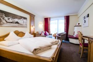 Posteľ alebo postele v izbe v ubytovaní Sporthotel Almhof