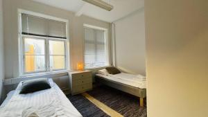 מיטה או מיטות בחדר ב-ApartmentInCopenhagen Apartment 1502