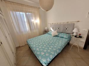 Кровать или кровати в номере Villa La Pelosa Stintino