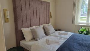 Posteľ alebo postele v izbe v ubytovaní MANOR Boutique Hotel