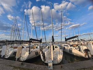 a group of boats docked in a harbor at Port Yellow in Giżycko