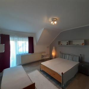 Voodi või voodid majutusasutuse HANNA Apartman toas