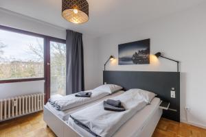 Säng eller sängar i ett rum på Glück Auf Appartements Kammerstr. Duisburg
