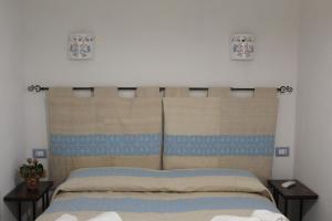 Posteľ alebo postele v izbe v ubytovaní B&B Sa Pedra Longa