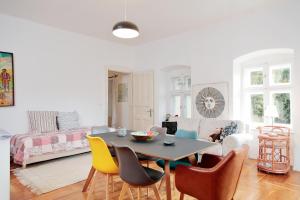 a living room with a table and chairs at Angel Holiday home in Szentantalfa +11 photos