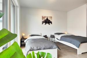 Postel nebo postele na pokoji v ubytování Modern Apartment near Offenbach in Seligenstadt