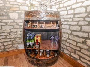 a drink stand in a room with bottles of alcohol at The Old Stables in Chippenham