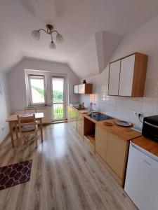 Kuchyň nebo kuchyňský kout v ubytování Apartament Albion