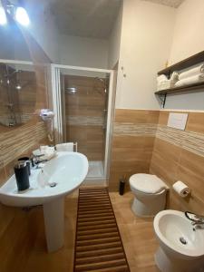 a bathroom with a sink and a toilet at B&B Felice in Maratea