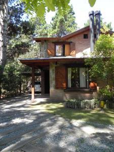 a house with a pathway in front of it at Acacias Blancas in Costa del Este