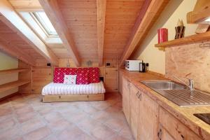 a kitchen with a sink and a bench in a room at La Baitina app D in Livigno +12 photos