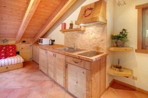 a kitchen with a sink and a counter top at La Baitina app D in Livigno