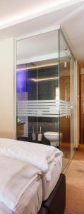 Hotel Tirol Fiss 4Sterne Superior客房内的一张或多张床位