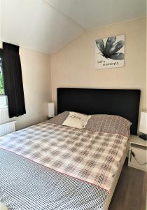 Posteľ alebo postele v izbe v ubytovaní Mooi Chalet voor een Top Vakantie aan Zee