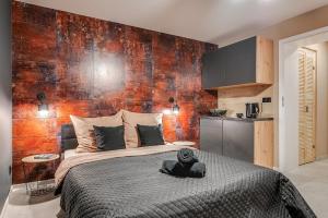 Posteľ alebo postele v izbe v ubytovaní Loft House Apartment Studio z ogródkiem 1