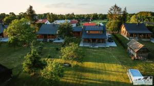 an aerial view of a house with a yard at Niemirowska Osada in Niemirów