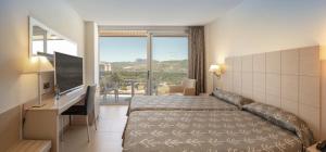 Posteľ alebo postele v izbe v ubytovaní Hotel RH Bayren Parc