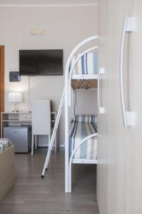 A bed or beds in a room at BluRiva Hotel
