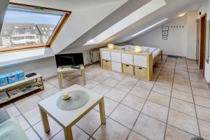 a large living room with a large window at fewo1846 Strandresidenz Wassersleben - Kleine Meerjungfrau - komfortables Studioapartment im Dachgeschoss in Harrislee