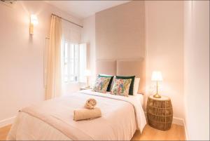 A bed or beds in a room at Merced10 Duplex 3I