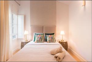 A bed or beds in a room at Merced10 Duplex 3I