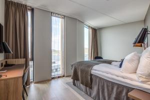 Postel nebo postele na pokoji v ubytování Quality Hotel Ramsalt