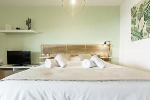 Posteľ alebo postele v izbe v ubytovaní Teatro Suites Málaga CITY FLAT