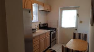 a kitchen with a sink and a stove top oven at AIRBAB Moon Gate East in Mount Pleasant