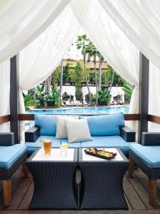 a patio with a table and chairs and a pool at Harrah's Resort Atlantic City Hotel & Casino in Atlantic City