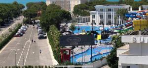 an amusement park with a large pool in a city at HOTEL Apartments ARDO in Golem