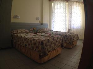 A bed or beds in a room at Semiz Apart Hotel