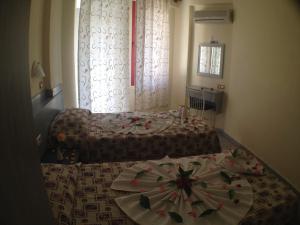 A bed or beds in a room at Semiz Apart Hotel