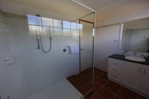 a bathroom with a shower and a sink at Severnview in Ballandean