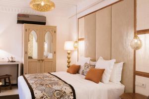 Postel nebo postele na pokoji v ubytování Riad Nyla Wellness and Spa
