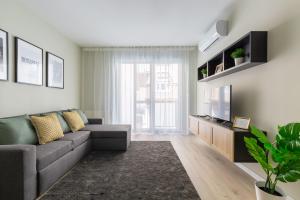 A television and/or entertainment centre at Second Home Apartment