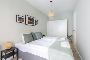Posteľ alebo postele v izbe v ubytovaní Second Home Apartment