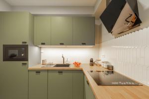 A kitchen or kitchenette at Second Home Apartment