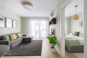 A bed or beds in a room at Second Home Apartment