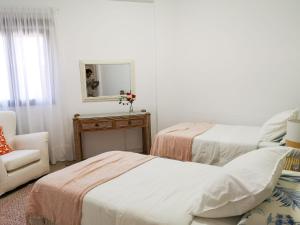Ein Bett oder Betten in einem Zimmer der Unterkunft Luisan Guanarteme