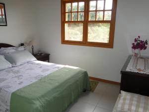 Krevet ili kreveti u jedinici u okviru objekta Casa Lago Neves 03